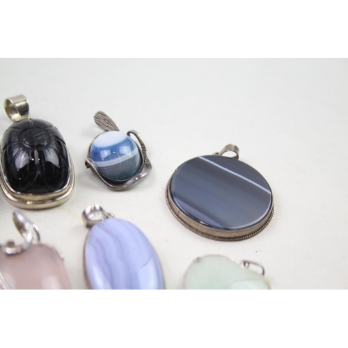 2452 - A collection of silver gemstone set pendants - approx. gross weight 175g