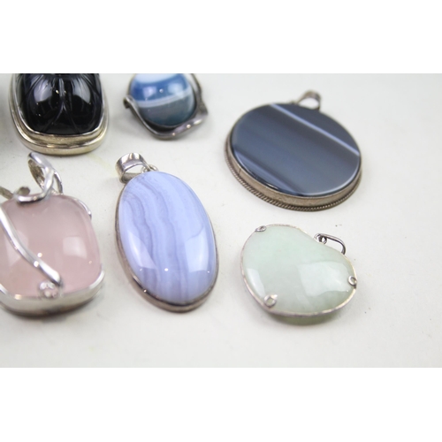 2452 - A collection of silver gemstone set pendants - approx. gross weight 175g