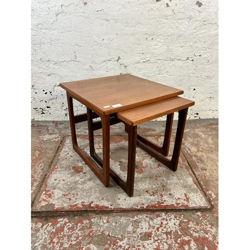 24 - A mid 20th century teak nest of tables - approx. 40cm high x 44cm square