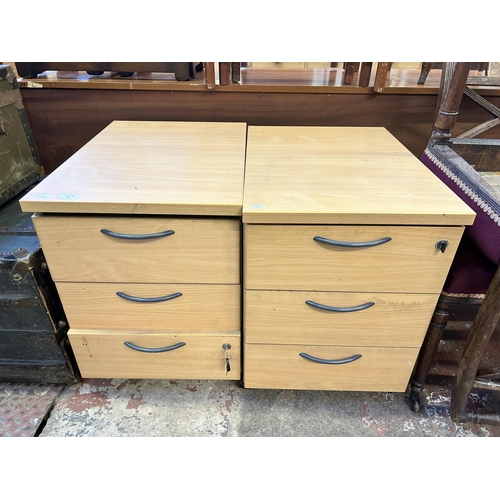 65 - A pair of modern beech three drawer office filing cabinets