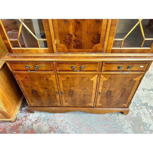 96 - A Georgian style yew wood astral glazed bureau bookcase