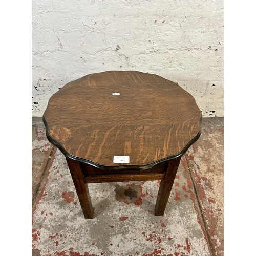 110 - A mid 20th century Morco oak piecrust edge sewing table - approx. 46cm high x 49cm wide x 49cm deep