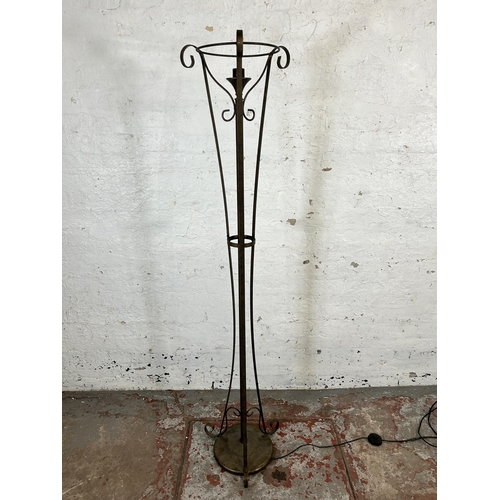 205 - A modern wrought metal standard lamp - approx. 170cm high