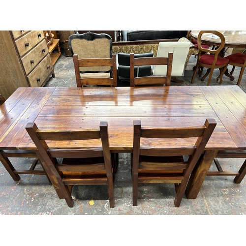 254 - An Indian sheesham wood rectangular extending dining table and six chairs - approx. 76cm high x 90cm... 