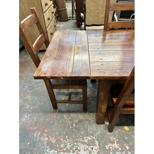 254 - An Indian sheesham wood rectangular extending dining table and six chairs - approx. 76cm high x 90cm... 