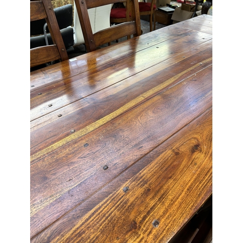 254 - An Indian sheesham wood rectangular extending dining table and six chairs - approx. 76cm high x 90cm... 