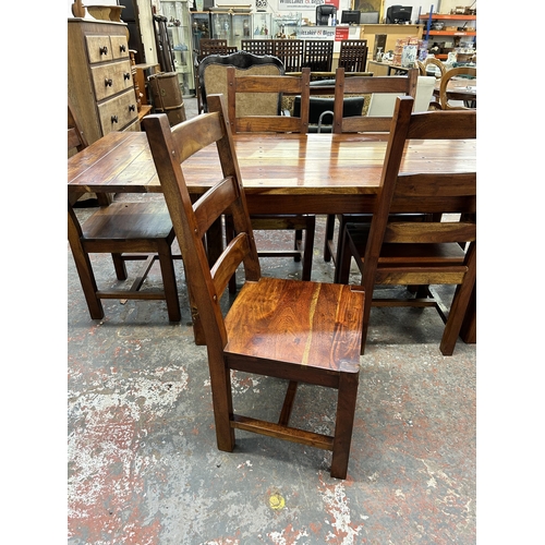 254 - An Indian sheesham wood rectangular extending dining table and six chairs - approx. 76cm high x 90cm... 