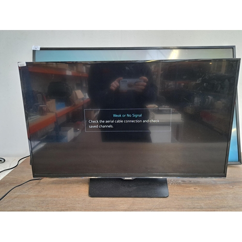 711 - Two Samsung TVs, one UE43NU7400U 43