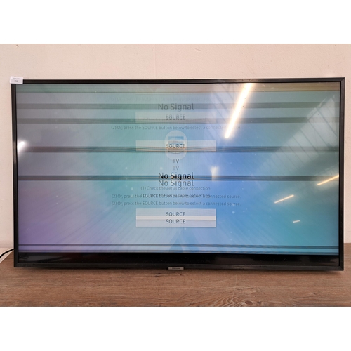 711 - Two Samsung TVs, one UE43NU7400U 43