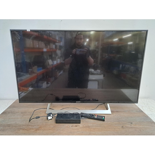 718 - A collection of AV items to include Sony Bravia KD-49XF8096 49