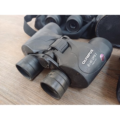 587 - Four pairs of binoculars, Olympus 8 x 40 DPS I, cased Docter αspherical 10 x 25 B pocket, Miranda 7 ... 