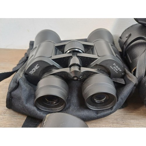 587 - Four pairs of binoculars, Olympus 8 x 40 DPS I, cased Docter αspherical 10 x 25 B pocket, Miranda 7 ... 