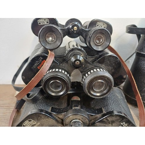 588 - Five pairs of binoculars to include Paralux 8 x 30, Mark Scheffel 20 x 50, Swallow Luxe 12 x 60 (A/F... 