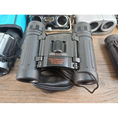 591 - A collection of pocket binoculars to include Summit, Executive etc.