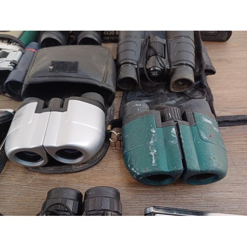 591 - A collection of pocket binoculars to include Summit, Executive etc.