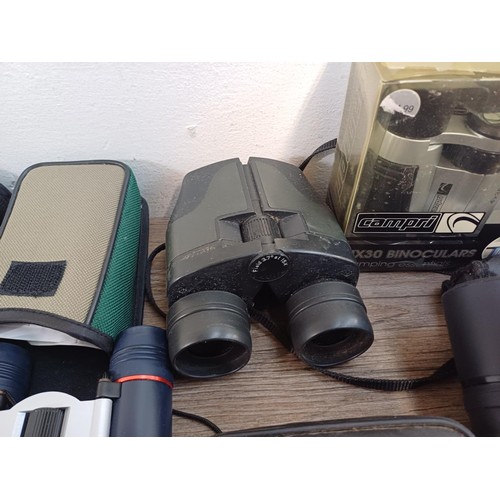 591 - A collection of pocket binoculars to include Summit, Executive etc.