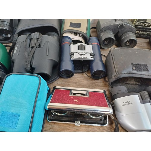 591 - A collection of pocket binoculars to include Summit, Executive etc.