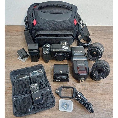 594 - A camera case containing Olympus E-330 four-thirds system DSLR camera, Zuiko 1:2 50mm lens, Zuiko 14... 