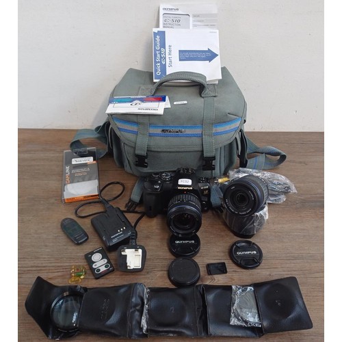 595 - An Olympus camera case containing Olympus E-510 four-thirds system 10mp DSLR camera fitted with Zuik... 