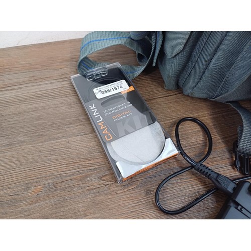 595 - An Olympus camera case containing Olympus E-510 four-thirds system 10mp DSLR camera fitted with Zuik... 