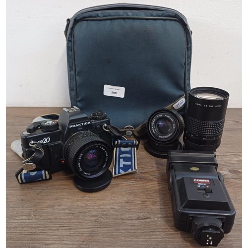 598 - A Praktica camera case containing Praktica BX20 35mm SLR camera fitted with Carl Zeiss P 1:2.8 f=28m... 