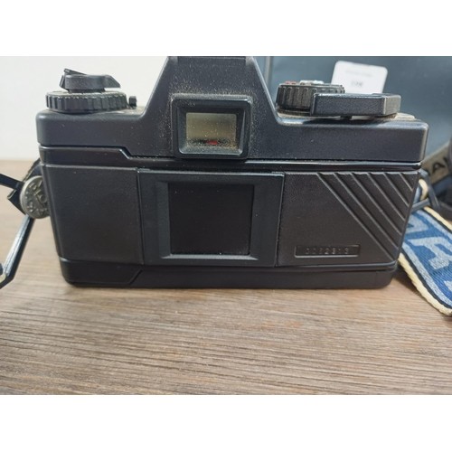 598 - A Praktica camera case containing Praktica BX20 35mm SLR camera fitted with Carl Zeiss P 1:2.8 f=28m... 