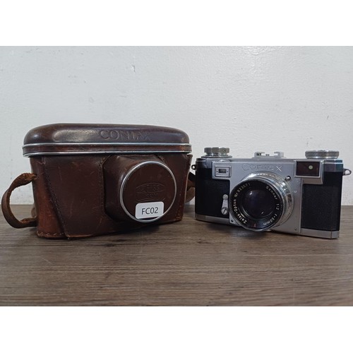 602 - A cased 1951 Zeiss Ikon Contax IIa 35mm rangefinder camera fitted with Zeiss-Opton Sonnar 1:2 f=50mm... 