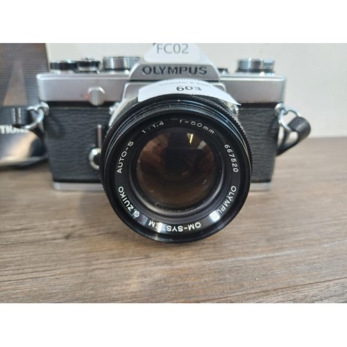 603 - An Olympus OM-1 35mm SLR camera fitted with G.Zuiko f=50mm 1:1.4 Auto-S lens with instruction manual