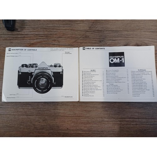 603 - An Olympus OM-1 35mm SLR camera fitted with G.Zuiko f=50mm 1:1.4 Auto-S lens with instruction manual