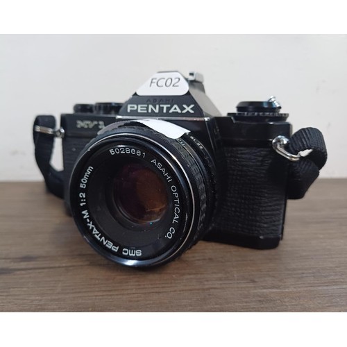 604 - An Asahi Pentax MV1 35mm SLR camera fitted with Pentax-M 50mm 1:2 lens