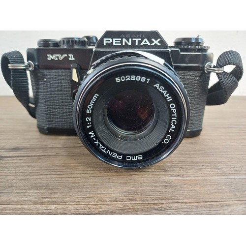 604 - An Asahi Pentax MV1 35mm SLR camera fitted with Pentax-M 50mm 1:2 lens