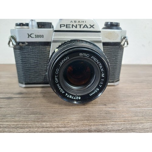 607 - An Asahi Pentax K1000 35mm SLR camera fitted with Pentax-M 1:1.7 50mm lens