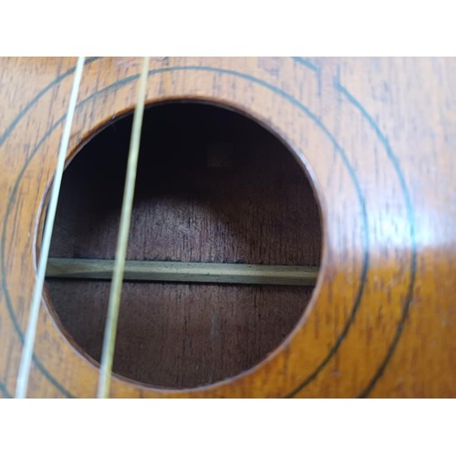 800B - A cased mid 20th century soprano ukulele with 'Lilli Marlene' single sheet, boxed pitch pipe, felt p... 