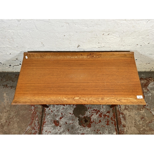 100 - A mid 20th century teak rectangular two tier coffee table