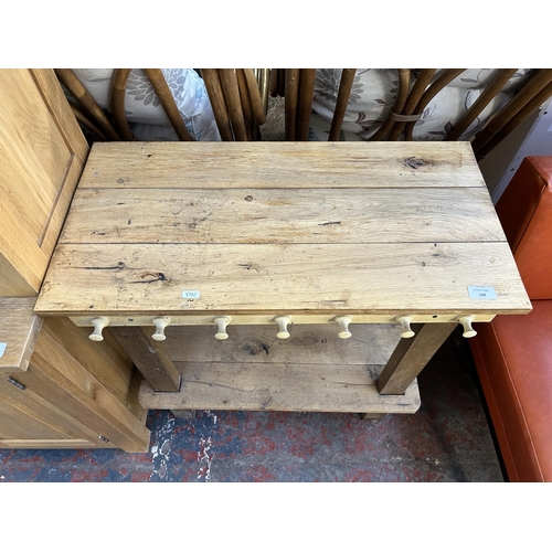 102 - A pine two tier side table