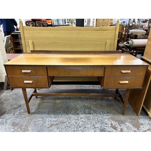 123 - A mid 20th century Gimson & Slater Ltd Vesper Furniture teak dressing table - approx. 77cm high x 15... 