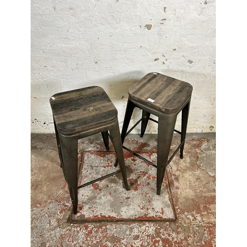 124 - A pair of industrial style oak and metal barstools - approx. 77cm high