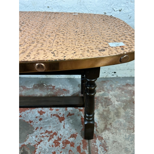 126 - A mid 20th century hammered copper and beech coffee table