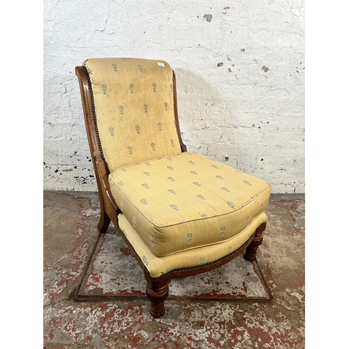 133 - A Victorian oak and fabric upholstered nursing chair