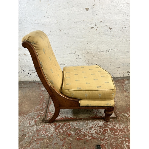 133 - A Victorian oak and fabric upholstered nursing chair