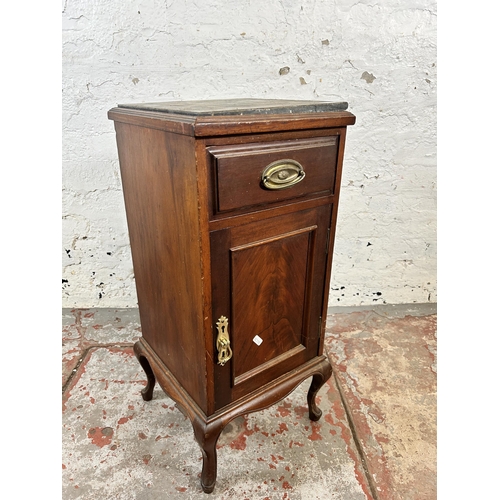 135 - An Edwardian mahogany bedside cabinet with marble top and cabriole supports