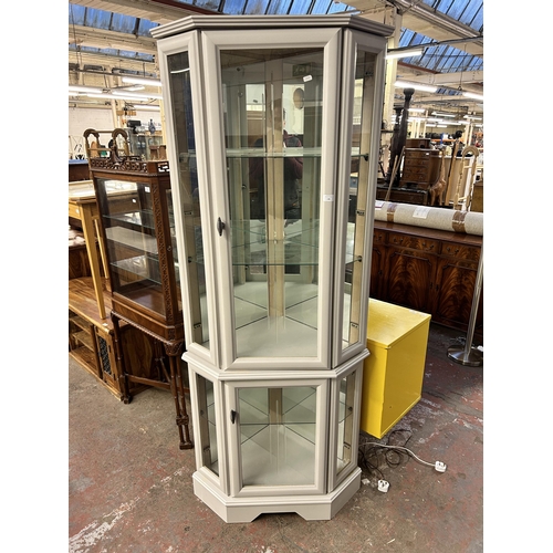 138 - A modern grey painted corner display cabinet with two glazed doors - approx. 192cm high x 79cm high ... 