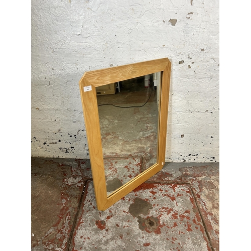 140 - A modern oak framed wall mirror - approx. 62cm high x 82cm wide