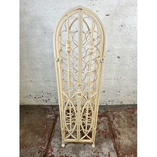 149 - A white painted wrought metal bottle rack cabinet - approx. 130cm high x 35cm wide x 35cm deep