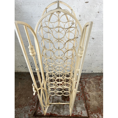 149 - A white painted wrought metal bottle rack cabinet - approx. 130cm high x 35cm wide x 35cm deep