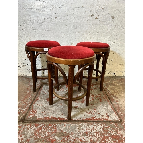 163 - Three bentwood and red fabric upholstered stools - approx. 52cm high
