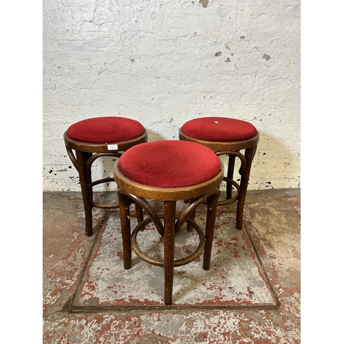 163 - Three bentwood and red fabric upholstered stools - approx. 52cm high
