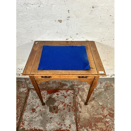 172 - An Arts and Crafts oak writing desk - approx. 77cm high x 73cm wide x 53cm deep