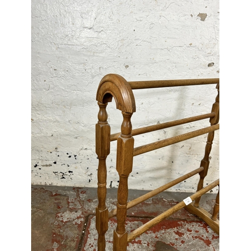 174 - A Victorian style oak towel rail