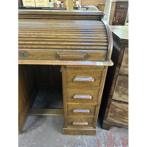 176 - An early 20th century Lebus oak roll top desk - approx. 102cm high x 107cm wide x 69cm deep